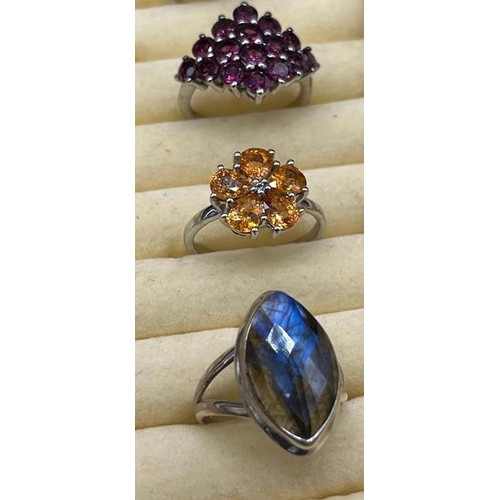 9 - A Lot of 5 various 925 silver and gem stone rings. Includes Sapphire and white topaz ring & Orange t... 