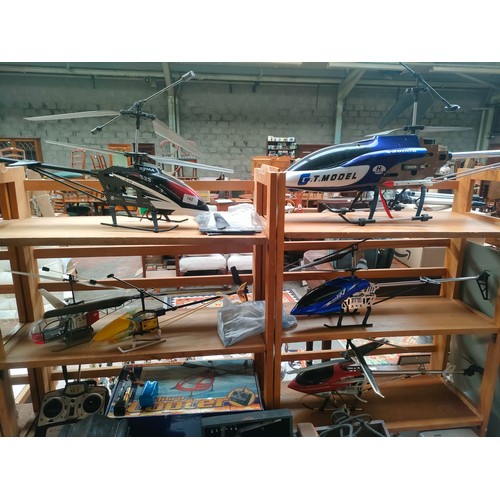 454 - Large selection of R C helicopter s with remote and crystals etc .