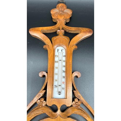 574 - Antique Barometer and thermometer within a hand carved art Nouveau form wood casing. [52cm in length... 