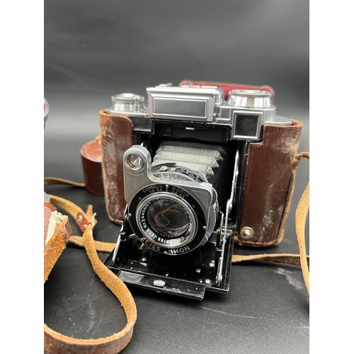 575 - Three vintage cameras and lenses to include Carl Zeiss Ikon Compur Rapid bellow camera, Carl Zeiss C... 