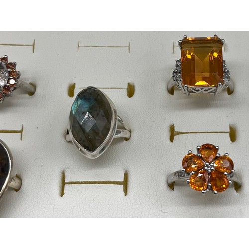 20 - A Lot of five 925 silver and gem stone rings. Includes Large round cut spinel stone off set by orang... 