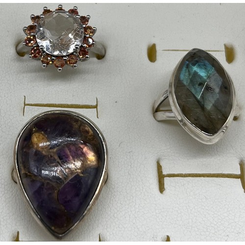 20 - A Lot of five 925 silver and gem stone rings. Includes Large round cut spinel stone off set by orang... 