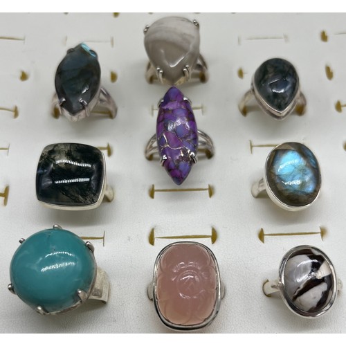 21 - A Lot of nine 925 silver and agate style stone rings.