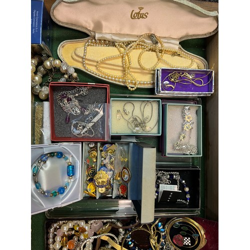 22A - A Large quantity of costume jewellery to include necklaces, bangles, pearls and musical wooden jewel... 