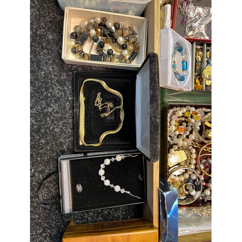 22A - A Large quantity of costume jewellery to include necklaces, bangles, pearls and musical wooden jewel... 