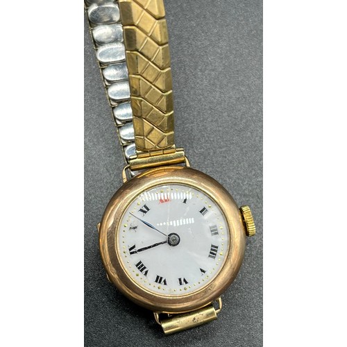 24 - 9ct gold cased ladies wristwatch with plated elasticated strap. Together with a vintage ladies Tisso... 