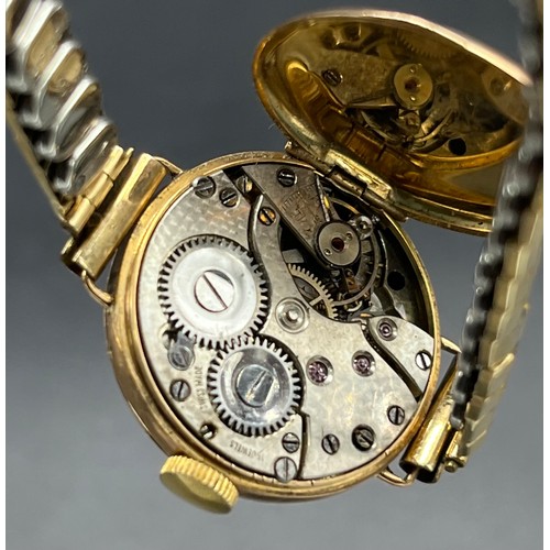 24 - 9ct gold cased ladies wristwatch with plated elasticated strap. Together with a vintage ladies Tisso... 