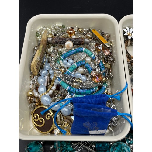 25 - Two small trays of costume jewellery to include necklaces, brooches, earrings, Fruit knives and ring... 