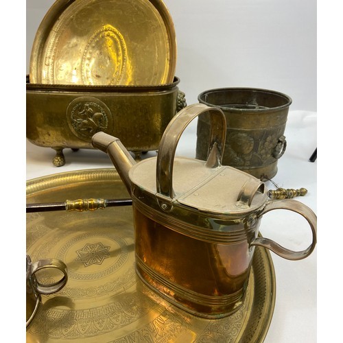 589 - A mixed lot of brass and copper ware to include arts & crafts lion head handle coal bucket, arts and... 