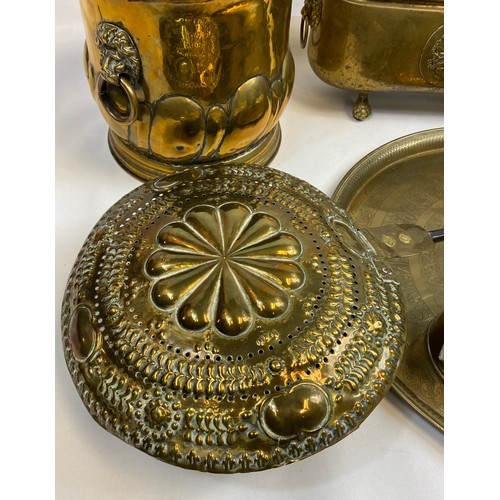 589 - A mixed lot of brass and copper ware to include arts & crafts lion head handle coal bucket, arts and... 