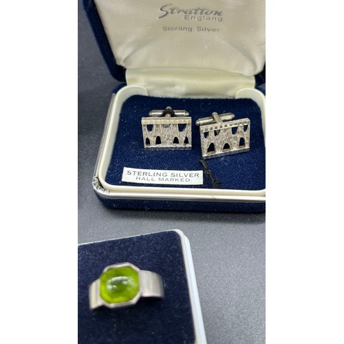 37 - 5 Various silver rings together with a pair of silver cuff links.