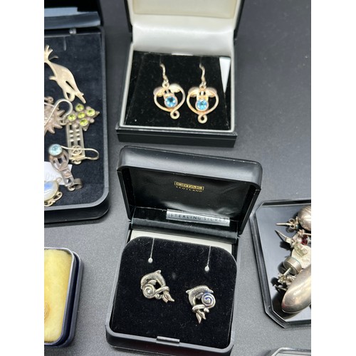 39 - A Quantity of silver and gem stone earrings to include Ortak dolphin design earrings. The Roses Coll... 