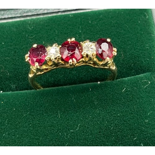 507 - Antique 18ct yellow gold Ruby and diamond ring. Consists of 1 round and 2 oval cut rubies. and 2 rou... 