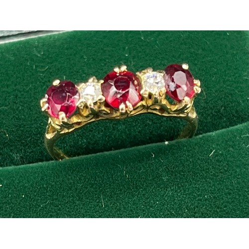 507 - Antique 18ct yellow gold Ruby and diamond ring. Consists of 1 round and 2 oval cut rubies. and 2 rou... 