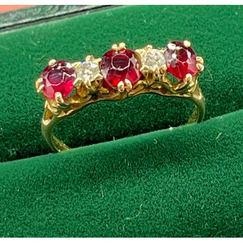 507 - Antique 18ct yellow gold Ruby and diamond ring. Consists of 1 round and 2 oval cut rubies. and 2 rou... 