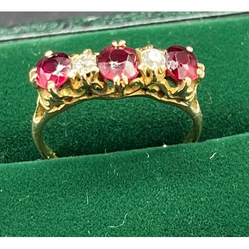 507 - Antique 18ct yellow gold Ruby and diamond ring. Consists of 1 round and 2 oval cut rubies. and 2 rou... 