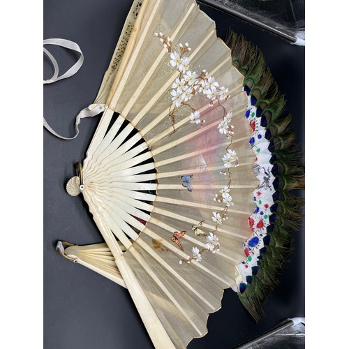 548 - A Lot of four antique Bone hand held fans and a tortoise and silver inlay purse. Fans include Chines... 