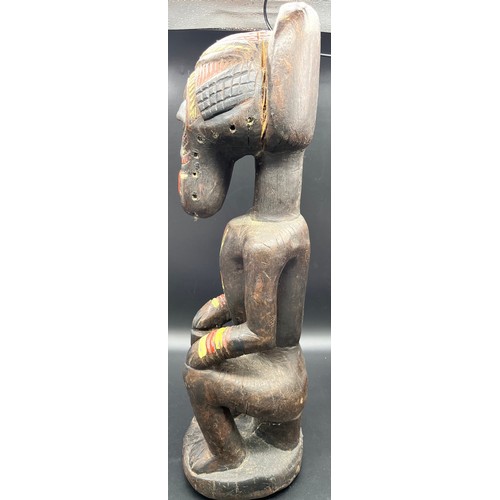 584 - Two large African hand carved tribal figures. [Tallest 54cm]