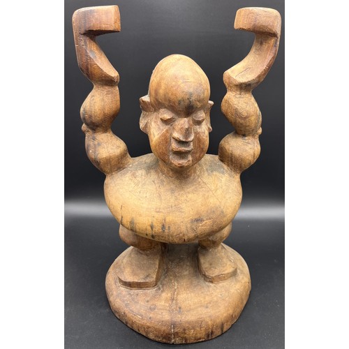 584 - Two large African hand carved tribal figures. [Tallest 54cm]