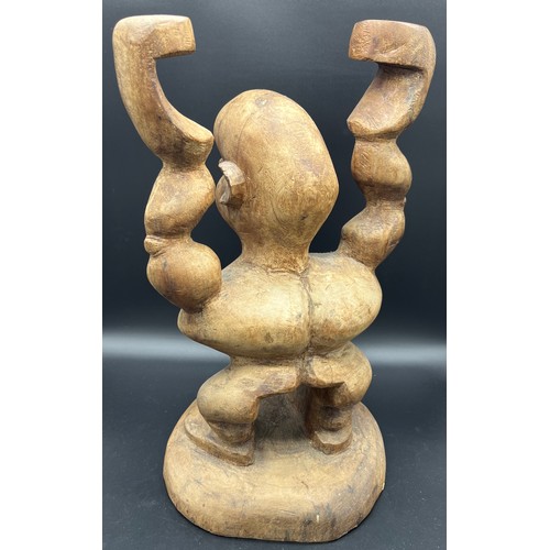 584 - Two large African hand carved tribal figures. [Tallest 54cm]