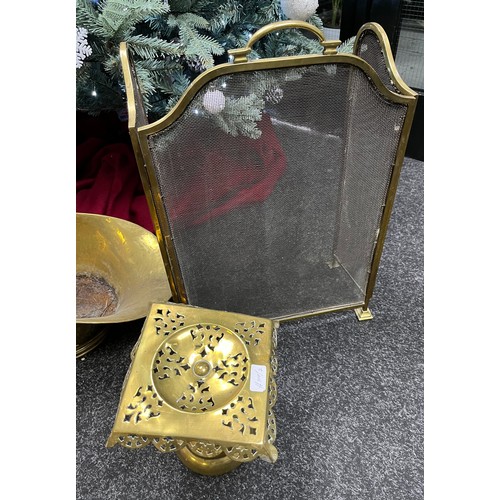 588 - Antique brass swing handle log basket, Brass ornate trivet stand and brass three section fire screen... 