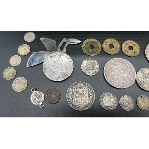 511 - A large quantity of mixed world coins to include various silver coins and collectable coins. 1928 Si... 