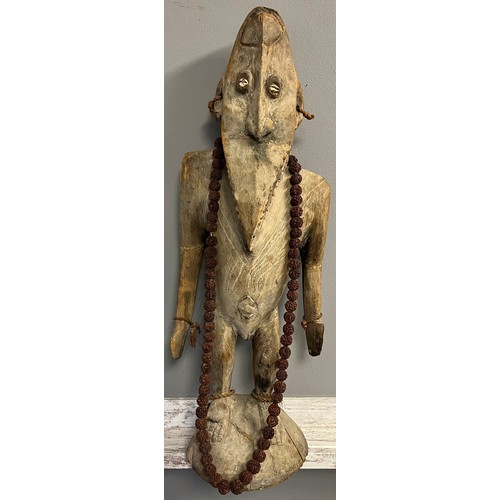 550 - Antique hand carved African Tribal Figure, Elongated face, comes with nut necklace. [72cm high]