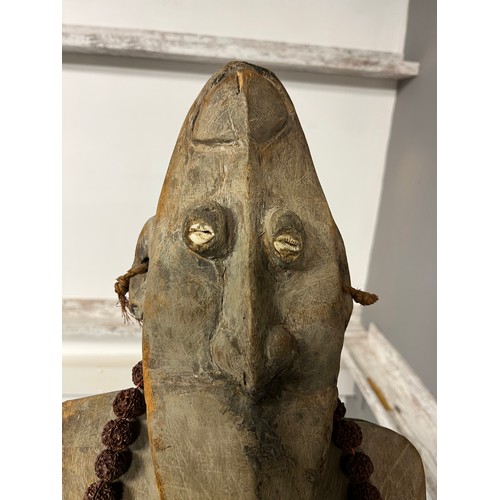 550 - Antique hand carved African Tribal Figure, Elongated face, comes with nut necklace. [72cm high]