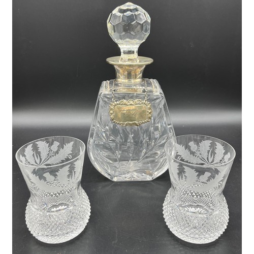 592 - A Crystal decanter with a London silver collar and Sheffield silver drinks label. Together with two ... 