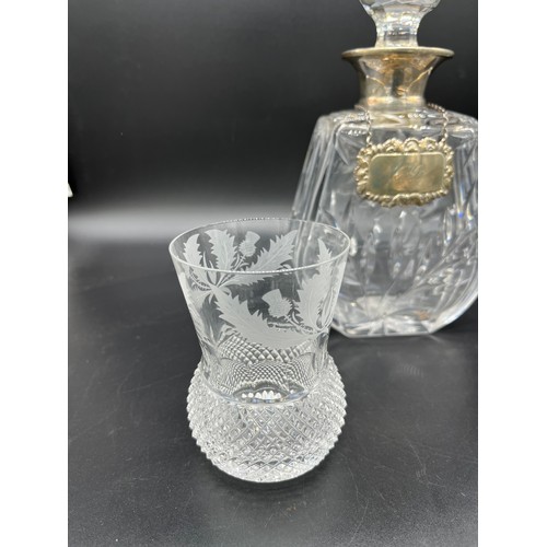 592 - A Crystal decanter with a London silver collar and Sheffield silver drinks label. Together with two ... 