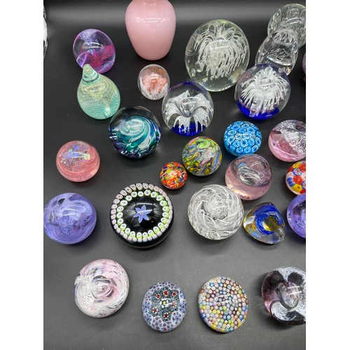 594 - A Quantity of mixed art glass paperweights to include Selkirk glass, Caithness, Edinburgh and Strath... 