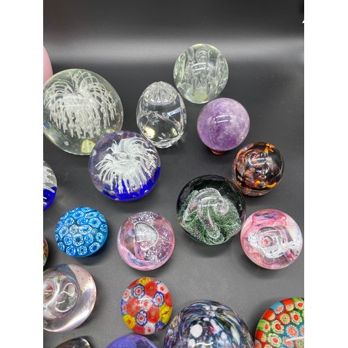 594 - A Quantity of mixed art glass paperweights to include Selkirk glass, Caithness, Edinburgh and Strath... 