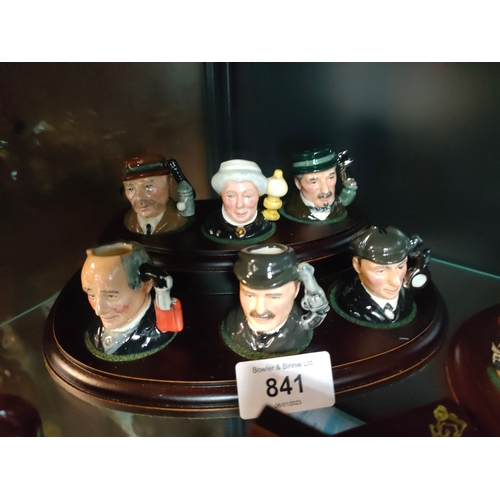 841 - A Collection of miniature Royal doulton Toby jugs on display plinths to include doctor Watson , prof... 