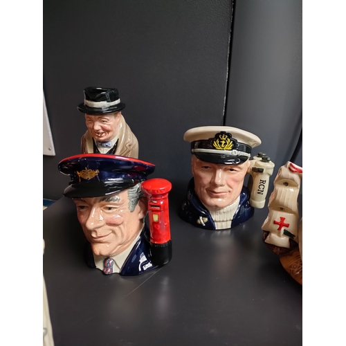 843 - A Collection of small Royal doulton Toby jugs includes Winston Churchill , the Canadian sailor , Rip... 