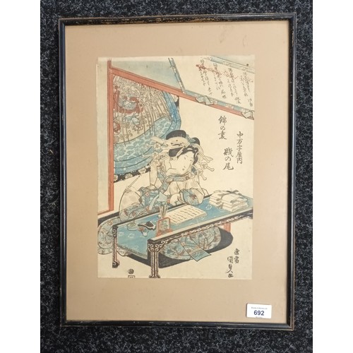 692 - Japanese coloured block print depicting geisha lady writing a manuscript. [50x38cm]