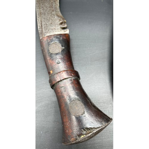 527 - A WW2 Military Issue Kukri Knife. Marked with military arrow and K45. Curved wooden handle and steel... 