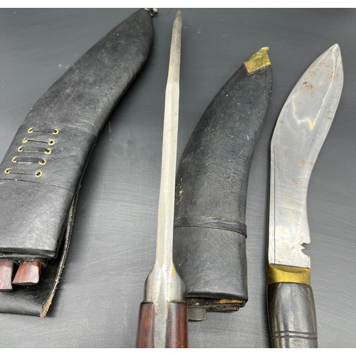 528 - Two Kukri Knives with sheathes.