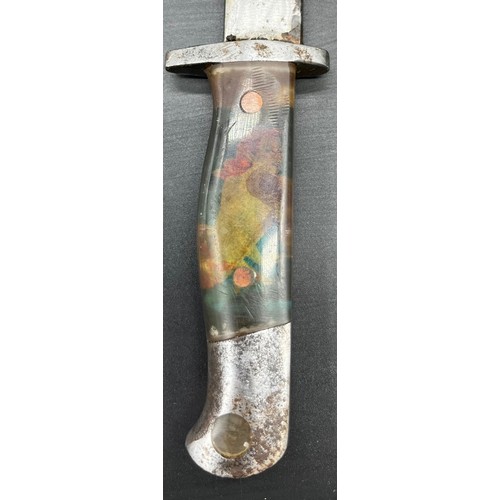 530 - Military bayonet/ dagger, designed with a pin up girl handle under resin. Comes with a protective sc... 