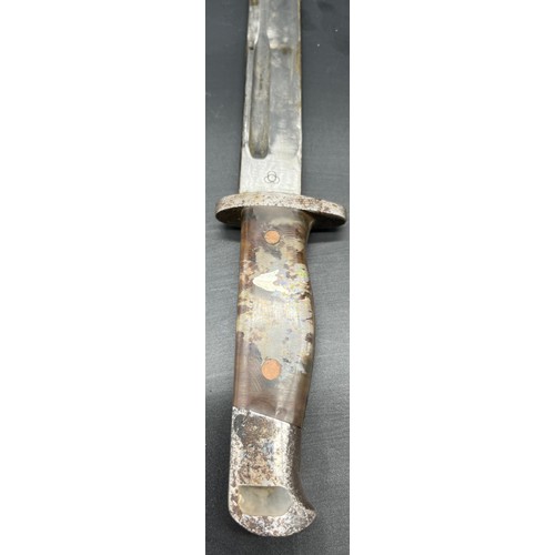 530 - Military bayonet/ dagger, designed with a pin up girl handle under resin. Comes with a protective sc... 