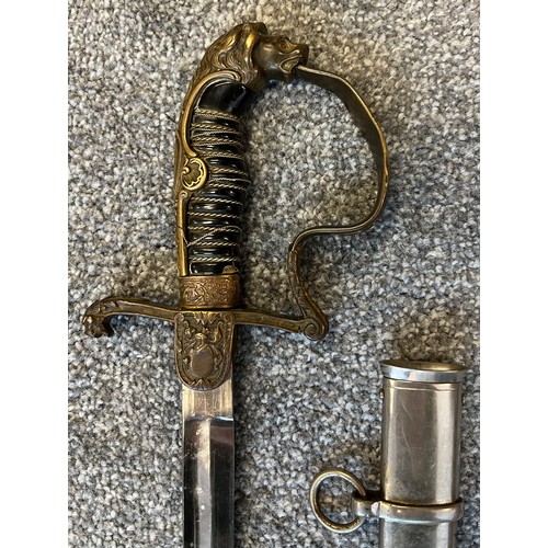 533 - A German Cavalry sword, Lion head pommel. Comes with a scabbard- not true to this sword.