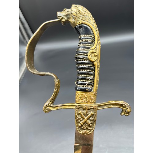 533 - A German Cavalry sword, Lion head pommel. Comes with a scabbard- not true to this sword.