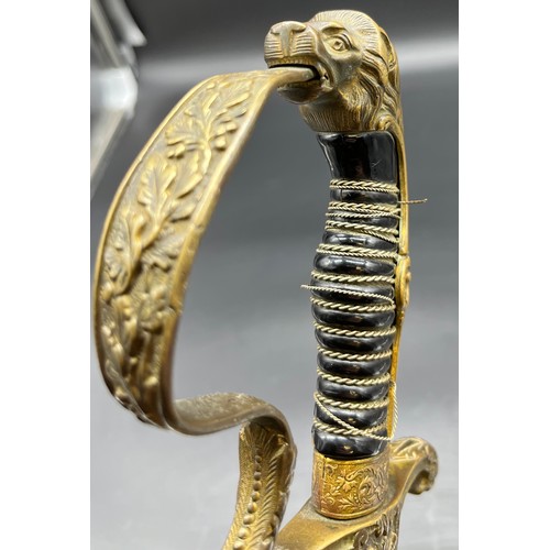 533 - A German Cavalry sword, Lion head pommel. Comes with a scabbard- not true to this sword.