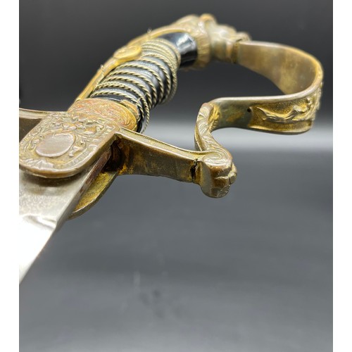 533 - A German Cavalry sword, Lion head pommel. Comes with a scabbard- not true to this sword.