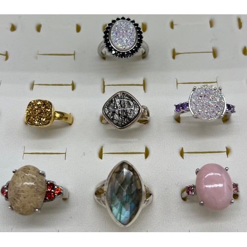 534 - A Lot of seven 925 silver rings set with various gem stones.