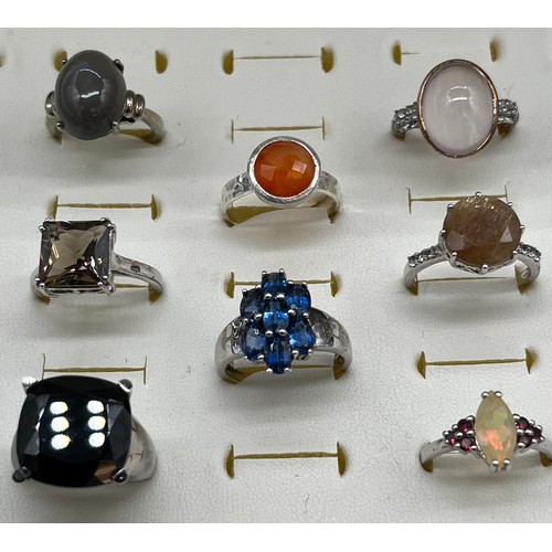 535 - A Collection of eight 925 silver and gem stone rings.