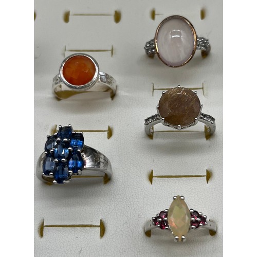 535 - A Collection of eight 925 silver and gem stone rings.