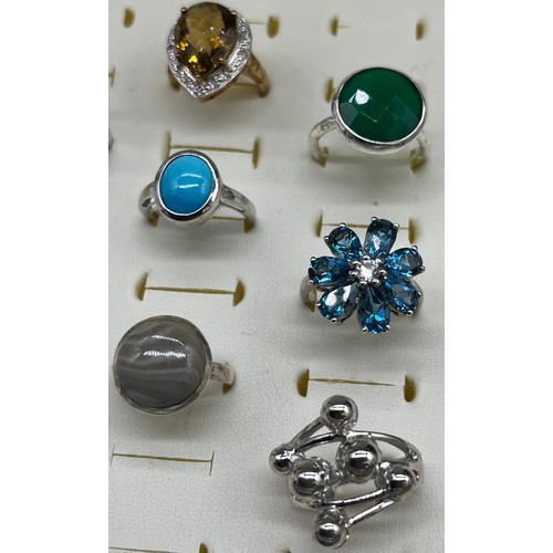 536 - A Collection of Nine 925 silver and gem stone rings.