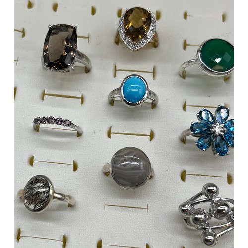 536 - A Collection of Nine 925 silver and gem stone rings.