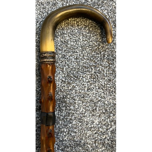 825 - Antique walking cane fitted with a hidden Toledo engraved sword. Horn handle and white metal collar.... 