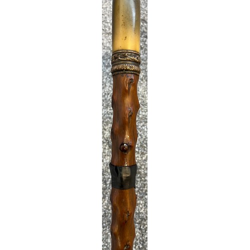 825 - Antique walking cane fitted with a hidden Toledo engraved sword. Horn handle and white metal collar.... 